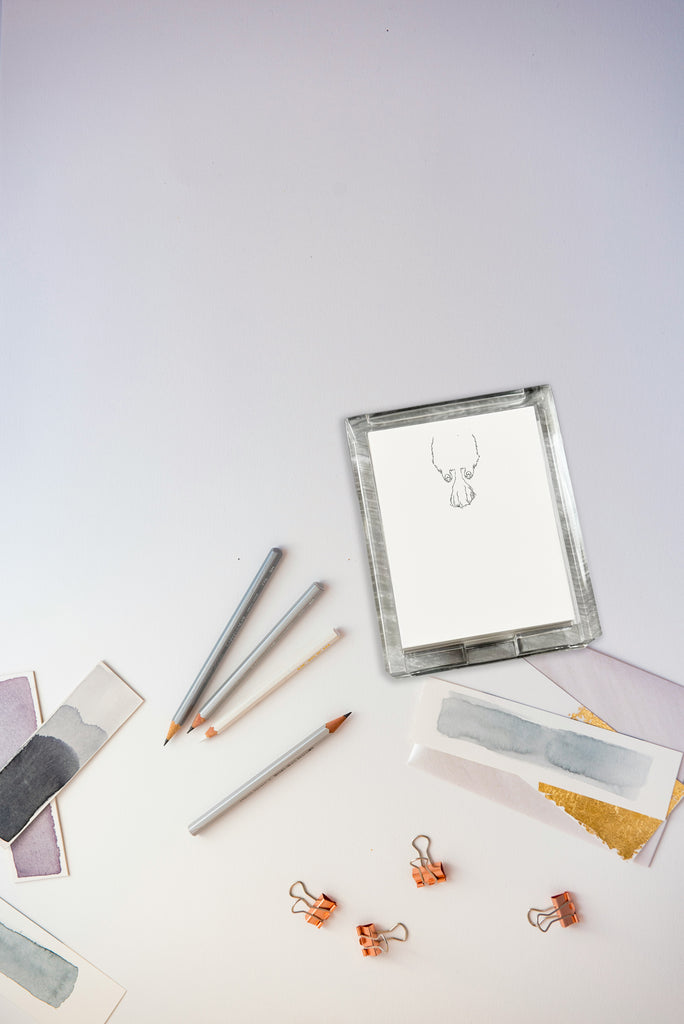 Sploot stationery including pencils, erasers, and clips on a white surface