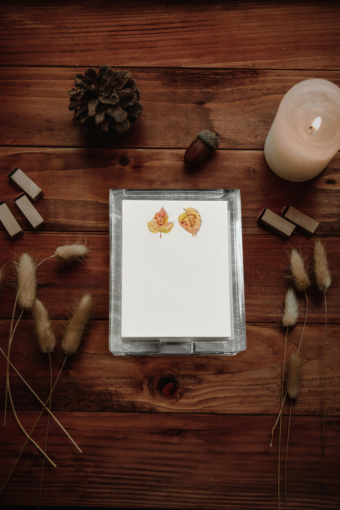 Custom Paw and Nose Print on Leaves autumn-themed stickers on a wooden surface with decorative elements.