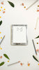 Acrylic notepad with a pet earsillustration surrounded by pencils, leaves, and decorative items on a white background
