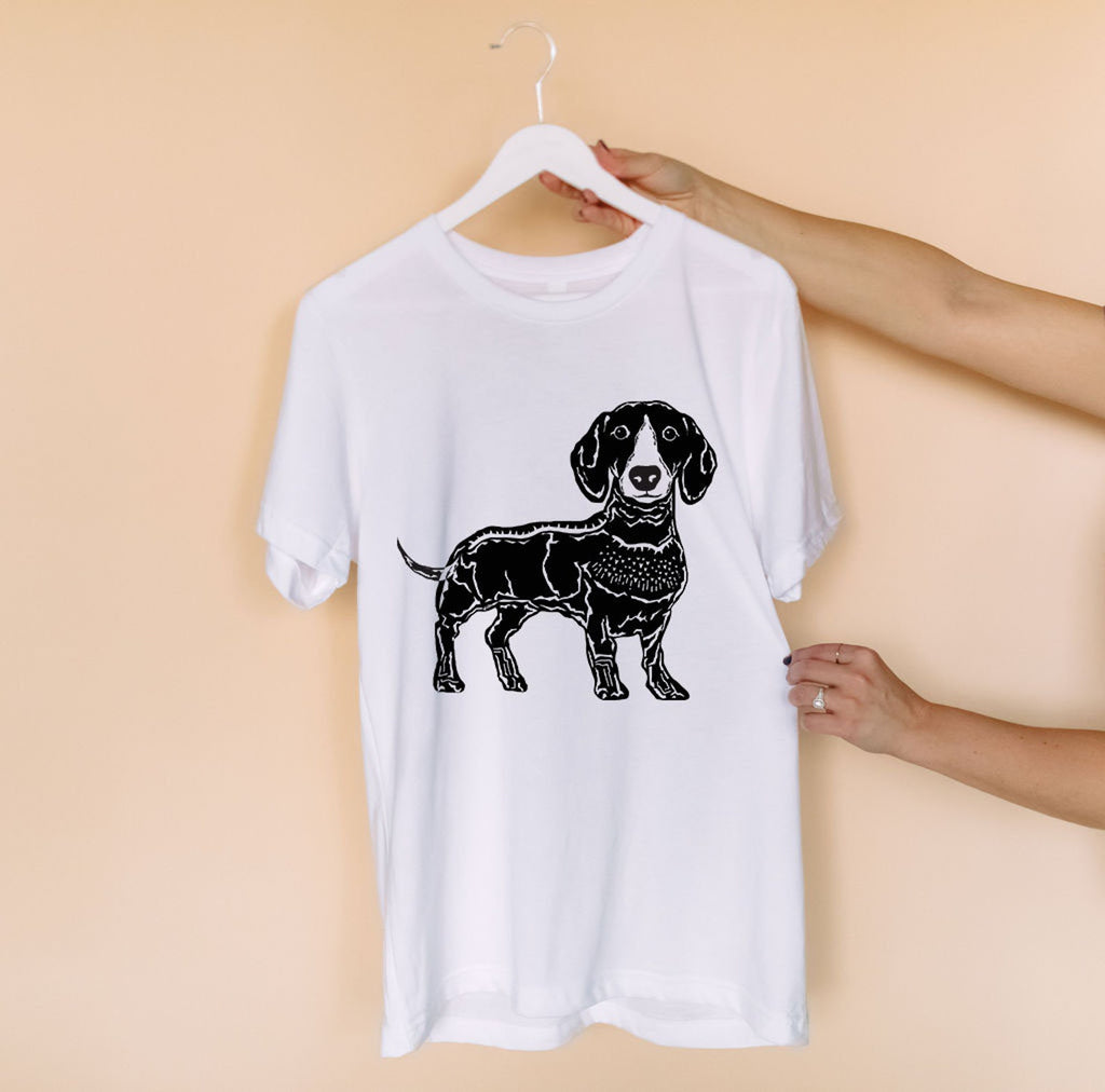 Linocut Dachshund printed with a direct to garment printer on a white Bella + Canvas t-shirt.