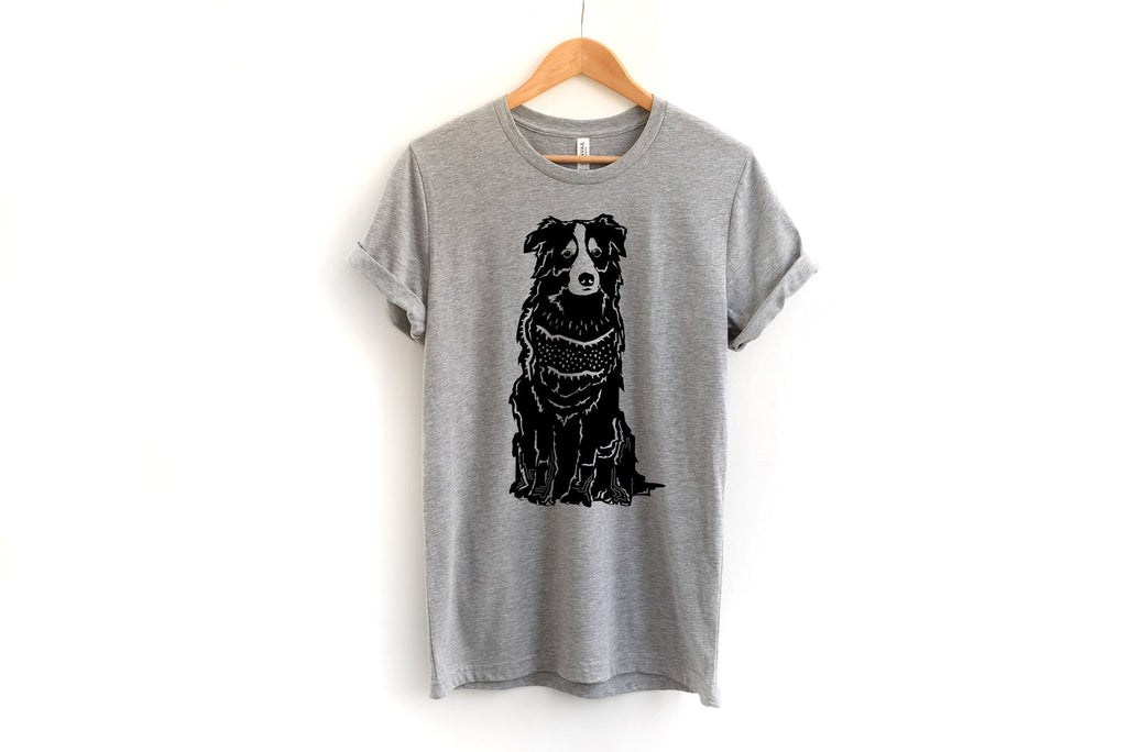 Australian Shepherd linocut graphic printed on a heather gray roll cuff crewneck t-shirt from Bella + Canvas