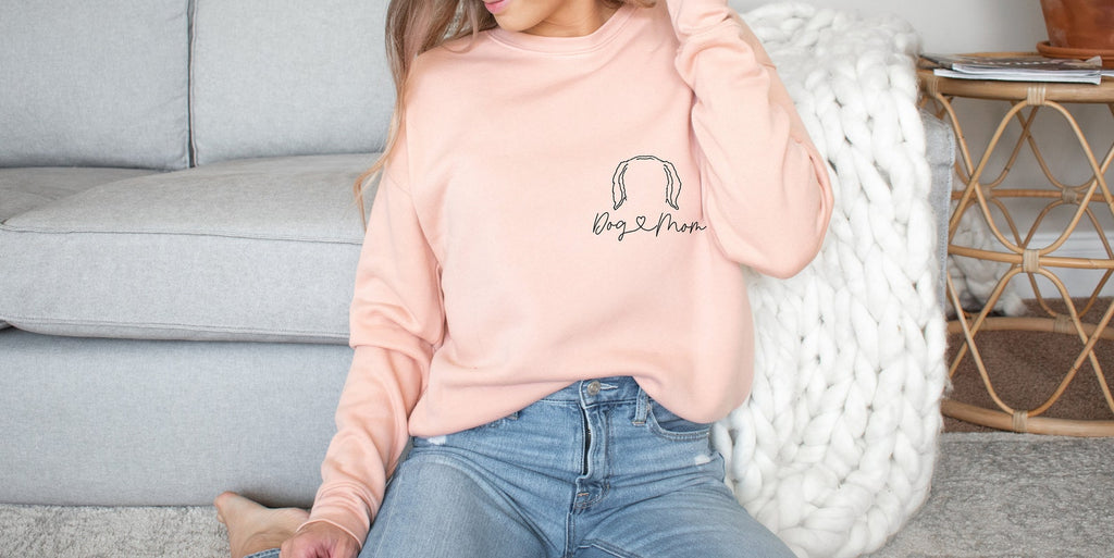 Personalized Pocket Dog, Cat, or Other Pet's Ears Outline Tattoo Inspired Crew Neck Bella + Canvas Unisex Sweatshirt in Peach - Personalized with "Dog Mom" and dog ears