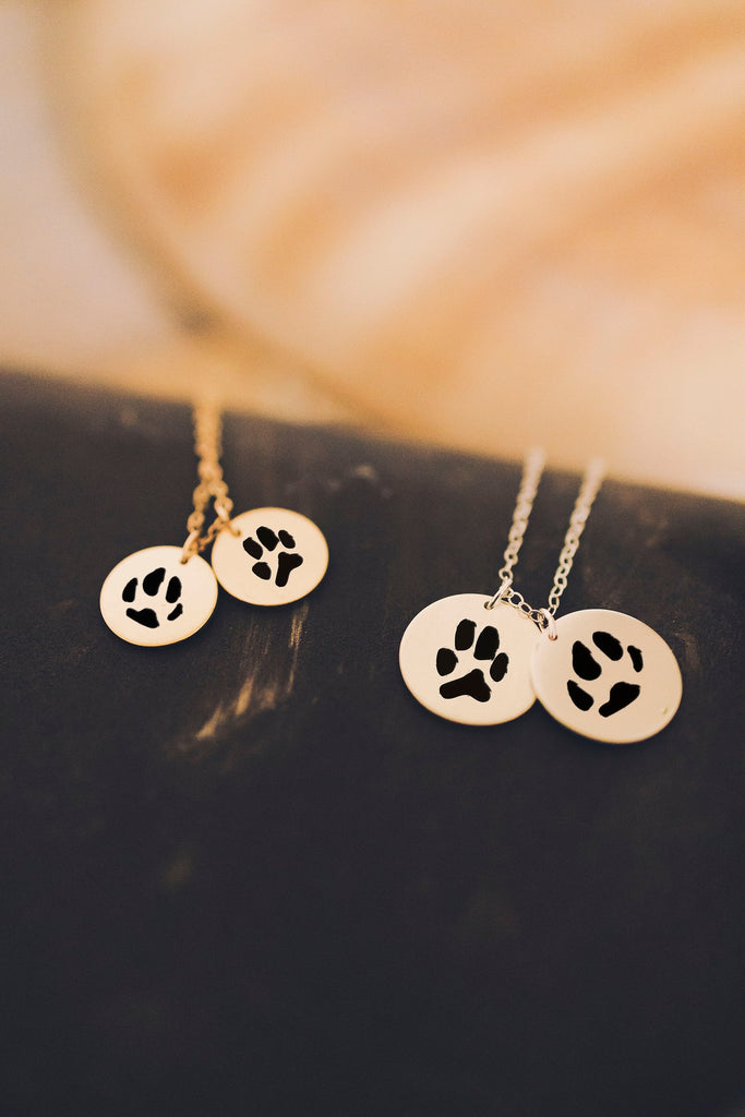 Custom Paw Print Dog or Cat Paw Print Multiple or Single Pendant Outline Tattoo Inspired Engraved Necklace - Shown is one necklace with two 13MM pendants in gold filled and one with two 16MM pendants in sterling silver