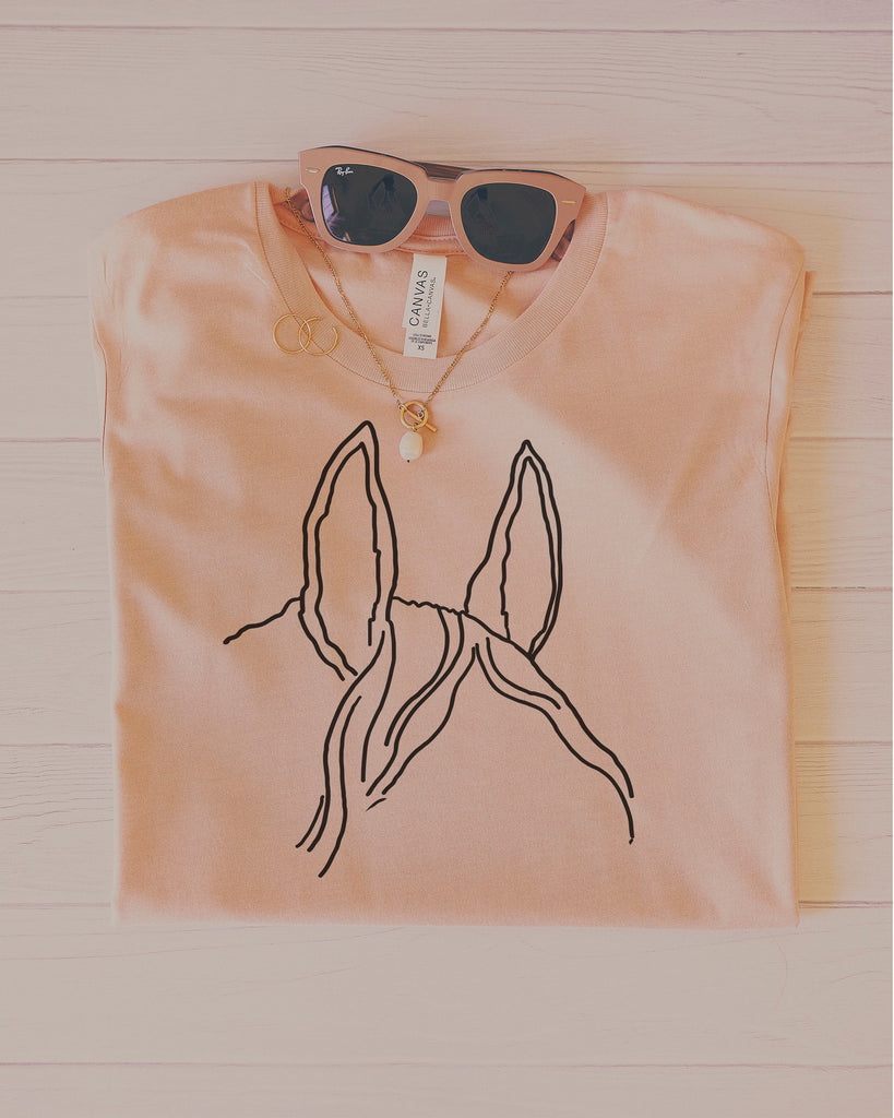 Custom Horse Ears Pocket Outline Tattoo Inspired Tee in Peach with Glasses, Necklace, and Rings
